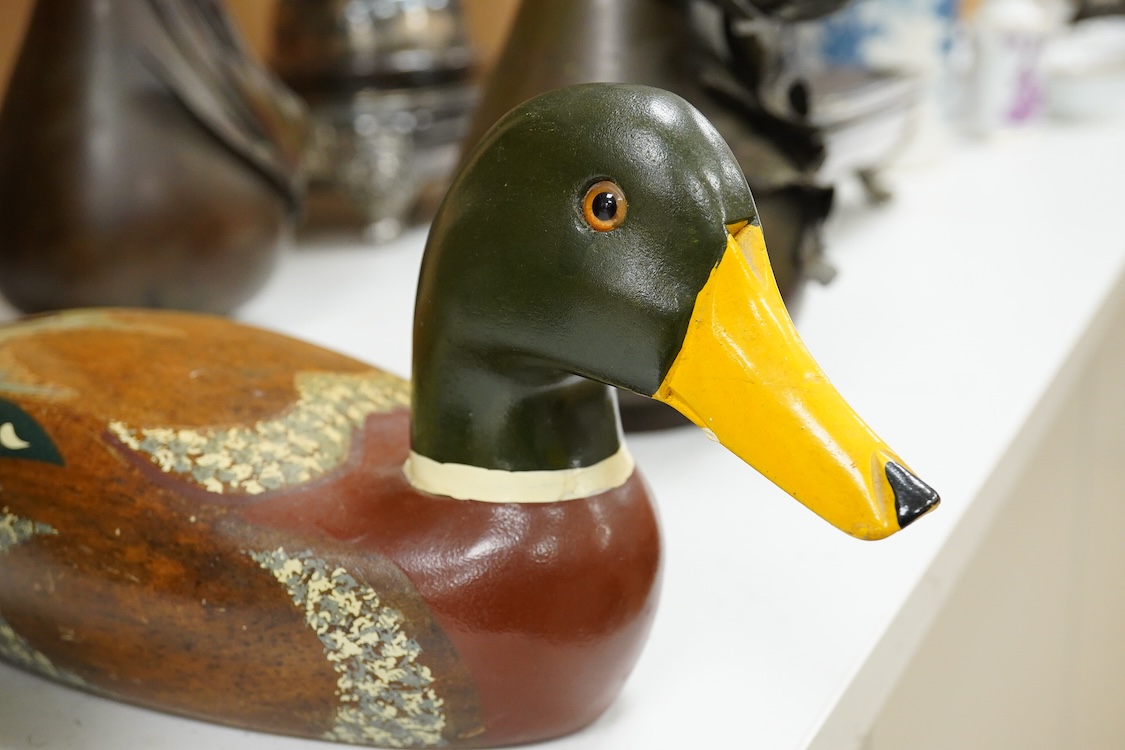 A decoy duck-42cm long, with a carved and painted wooden model of a duck. (2).